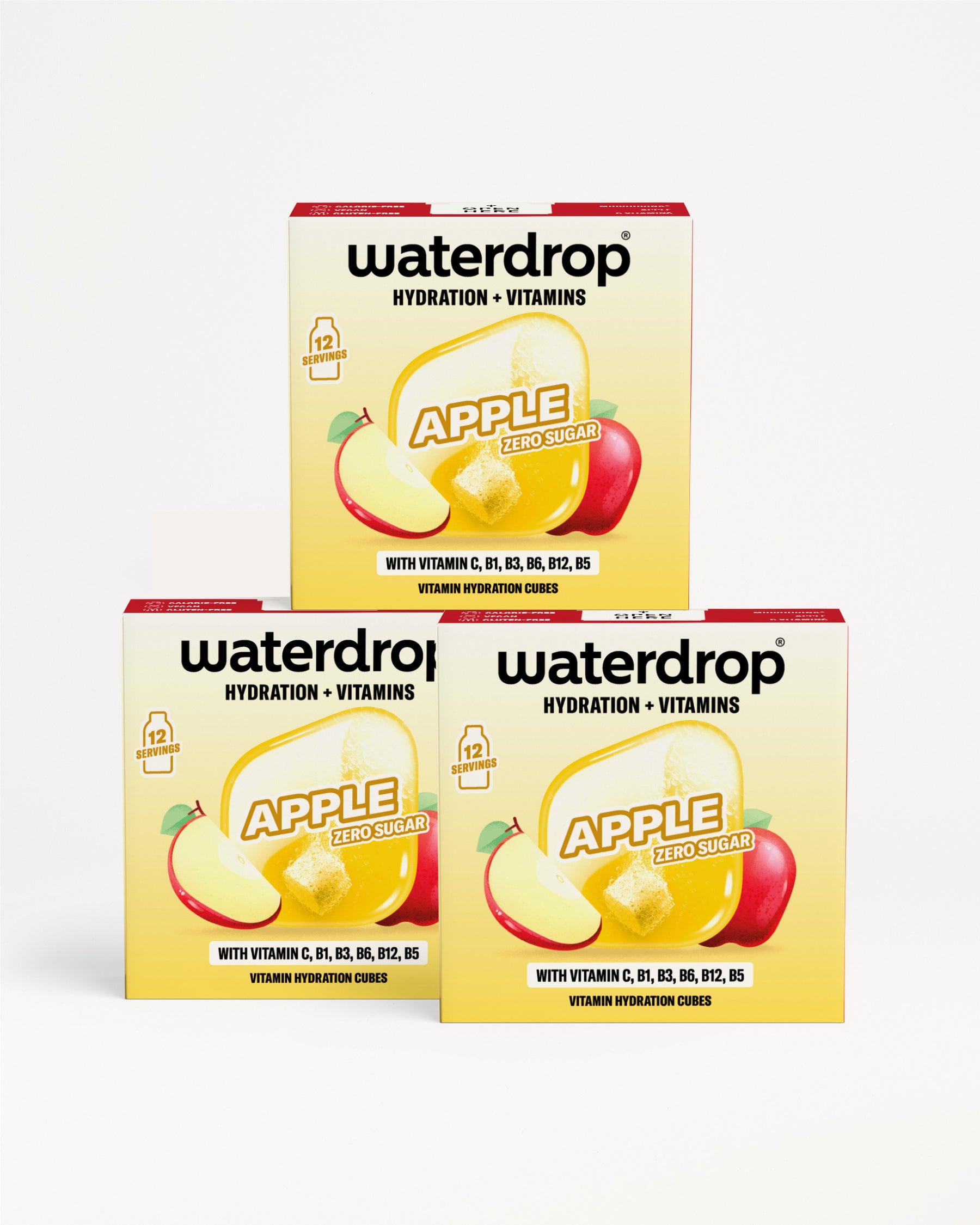 Trei cutii galbene Waterdrop cu ilustrația mărului, așezate în triunghi.